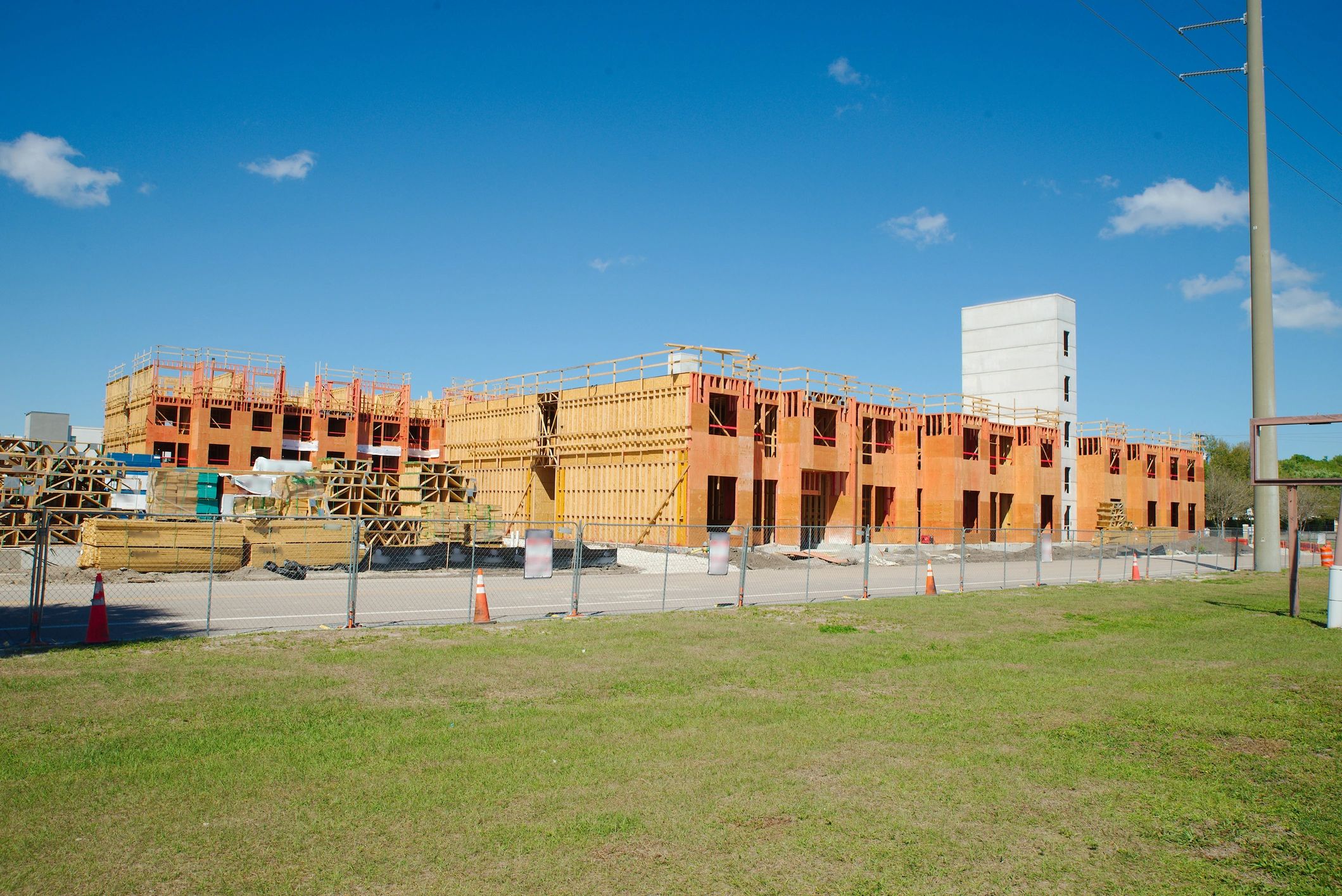 Commercial construction site secured with temporary fencing